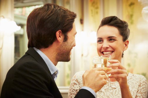 476850549 elegant couple celebrating with champagne gettyimages